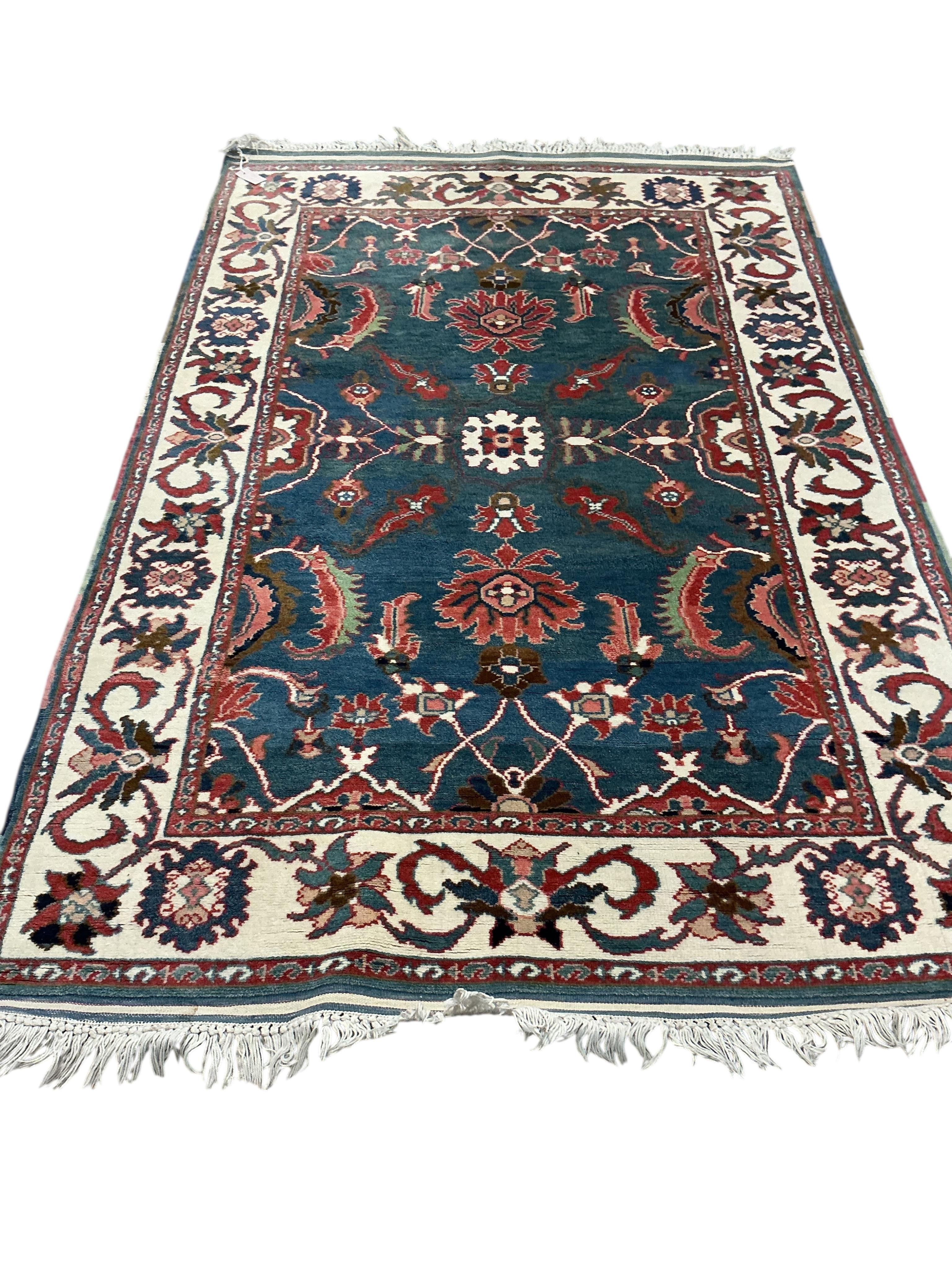 A Tabriz blue ground rug, 204 x 134cm.